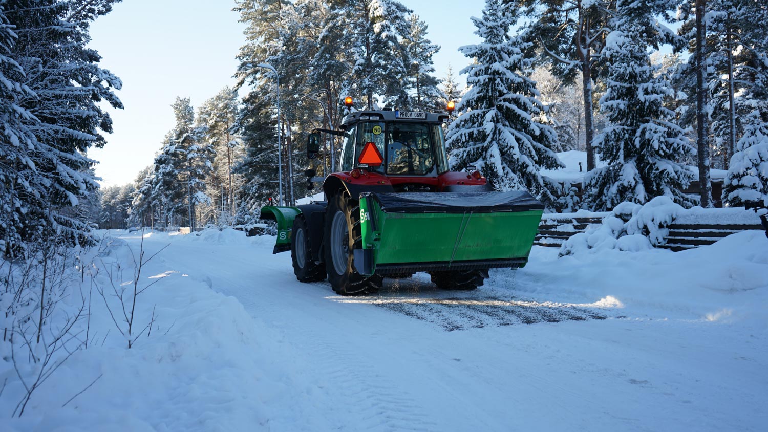 SAMI hot-dip galvanized SLH sand spreader on a Massey Ferguson tractor