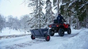 SAMI towed sand spreader S-290 towed by an ATV
