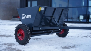 SAMI towed sand spreader S-290 towed by an ATV