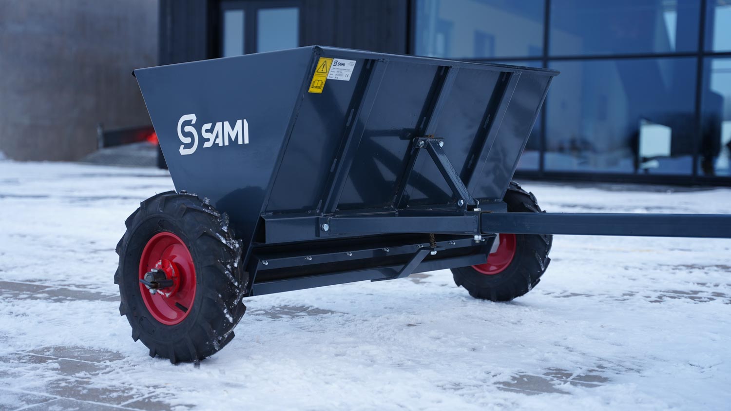 SAMI towed sand spreader S-290 towed by an ATV