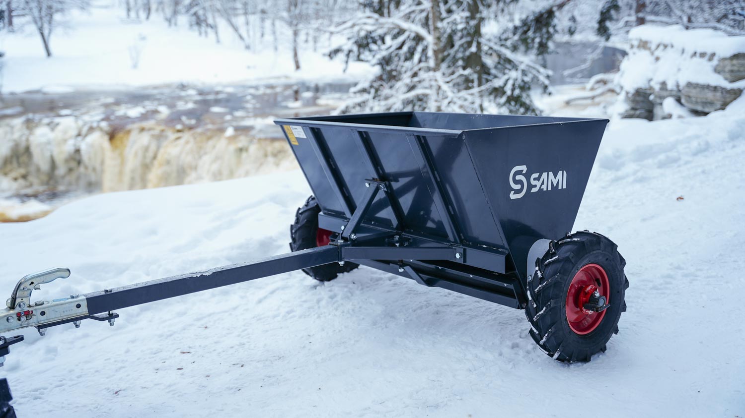 SAMI towed sand spreader S-290 towed by an ATV