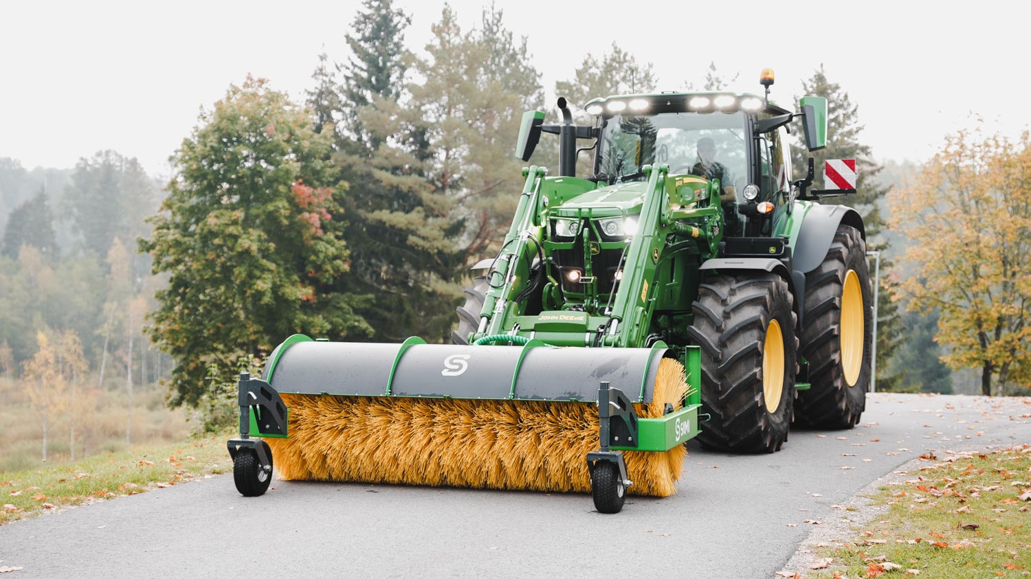 SAMI road sweeper HW-2700 on a John Deere 6R tractor