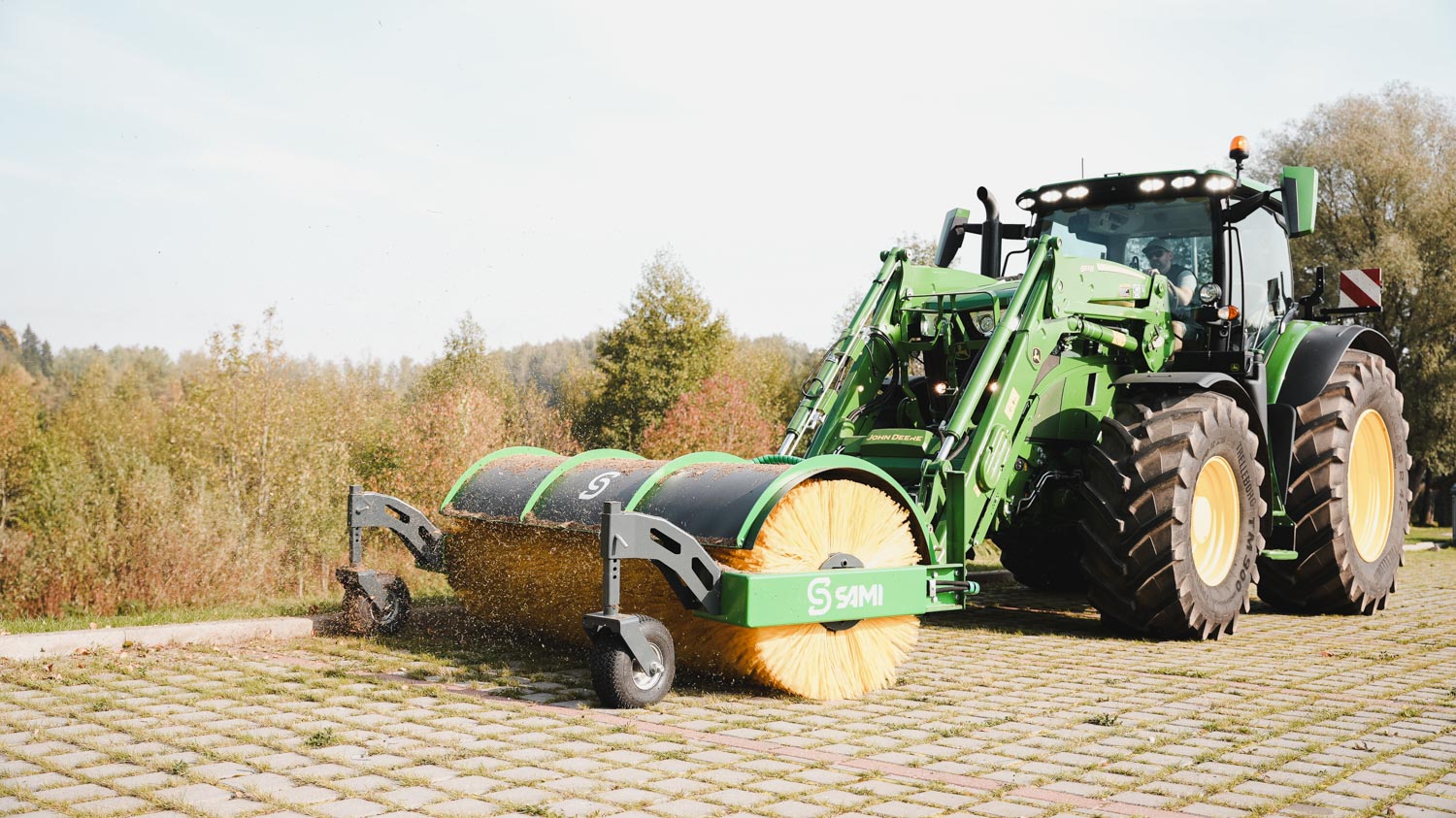 SAMI road sweeper HW-2700 on a John Deere 6R tractor